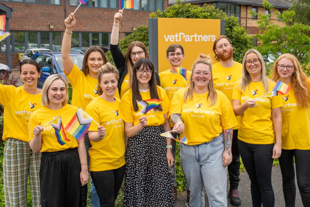 vetpartners central support team celebrating pride outside of york hq